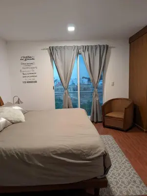 Cama o camas de una habitación en Depto nuevo cerca de parque FINSA