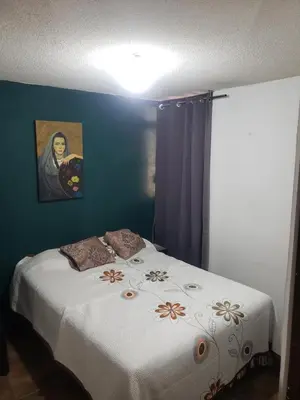 Cama o camas de una habitación en Departamento Jardín Magnolia