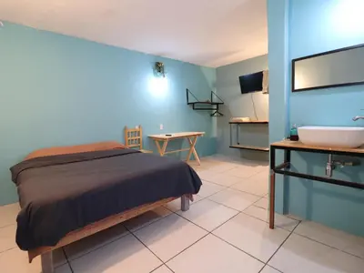 Una televisión o centro de entretenimiento en Casa Corazon Centro
