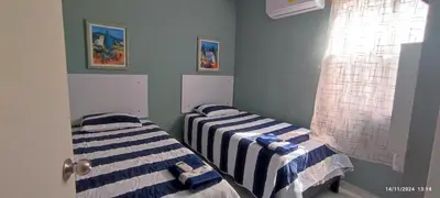 Cama o camas de una habitación en Valhalla Planta Baja cerca al Aeropuerto Factura