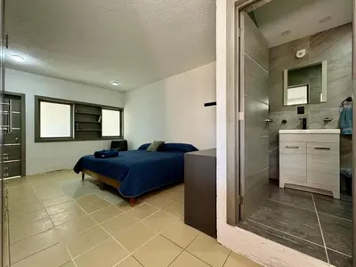 Cama o camas de una habitación en Casa contemporánea a pasos de galerías y averanda