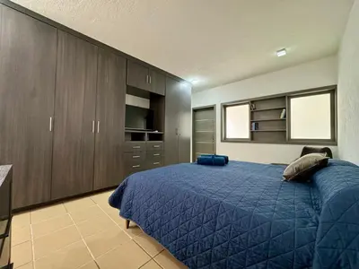Cama o camas de una habitación en Casa contemporánea a pasos de galerías y averanda