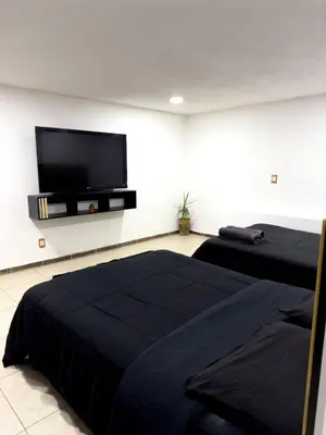 Una televisión o centro de entretenimiento en Alojamiento CARLO Y ABRIL
