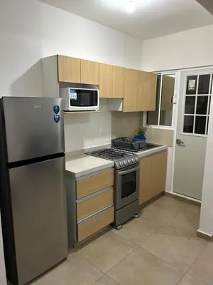 Una cocina o zona de cocina en Departamento tiempo de relax