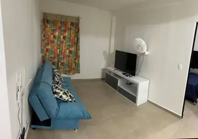 Una televisión o centro de entretenimiento en Departamento tiempo de relax