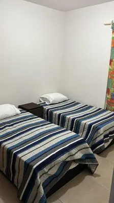 Cama o camas de una habitación en Departamento tiempo de relax