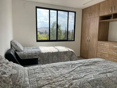 Cama o camas de una habitación en Lovely 3 bedroom condo with rooftop