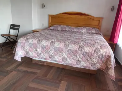Cama o camas de una habitación en Jardin Cualli Cochi
