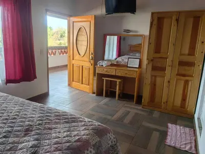 Cama o camas de una habitación en Jardin Cualli Cochi