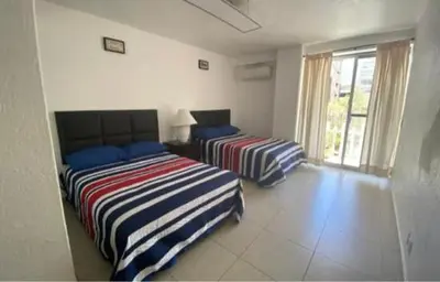 Cama o camas de una habitación en Depto Ibiza a media cuadra de La PLAYA