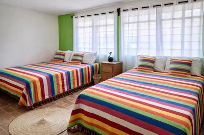 Cama o camas de una habitación en Hostal Casa Alixel