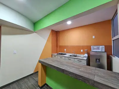Una cocina o zona de cocina en Sensity Home Departamento 7, Colorido y amplio Familiar