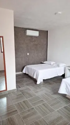 Cama o camas de una habitación en La Playita