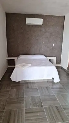 Cama o camas de una habitación en La Playita