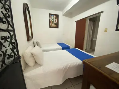 Cama o camas de una habitación en Hotel Nacional
