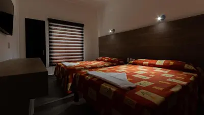 Cama o camas de una habitación en Hotel Galería del Ángel
