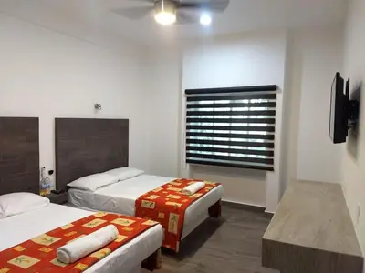 Cama o camas de una habitación en Hotel Galería del Ángel