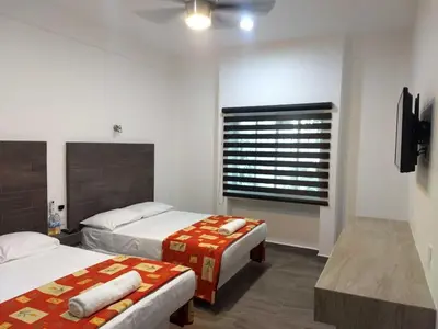 Cama o camas de una habitación en Hotel Galería del Ángel