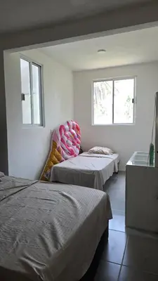 Cama o camas de una habitación en casa con club de playa