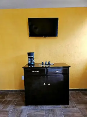 Una televisión o centro de entretenimiento en Sensity home Casa Flores, Hogareña y encantadora