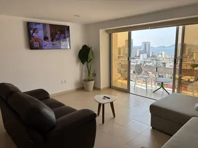 Zona de estar de Departamento con vista a la bahia