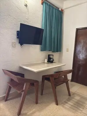 Una televisión o centro de entretenimiento en Hotel Acapulco Club Diamante
