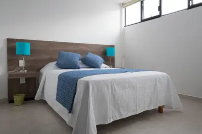 Cama o camas de una habitación en R1 More Oaxaca Impossible