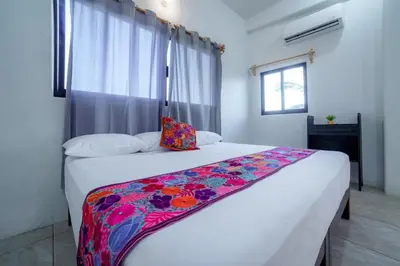 Cama o camas de una habitación en Casa Flores Zicatela