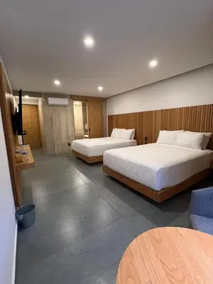 Cama o camas de una habitación en Casa Begonias Hotel mas Villas