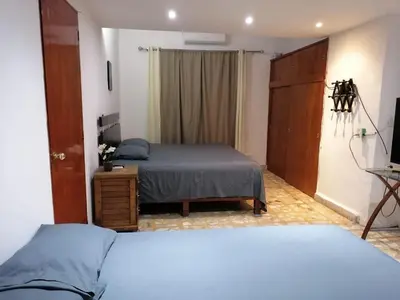 Cama o camas de una habitación en Amplio departamento