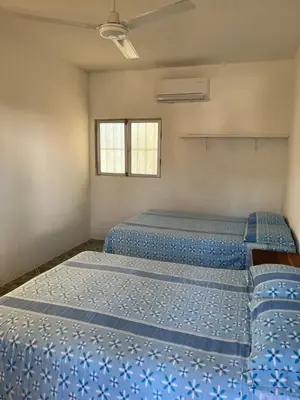 Cama o camas de una habitación en Cabañas Edda