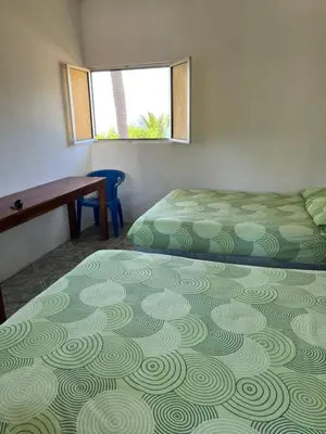 Cama o camas de una habitación en Cabañas Edda
