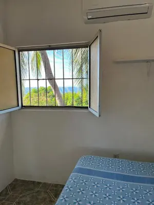 Cama o camas de una habitación en Cabañas Edda