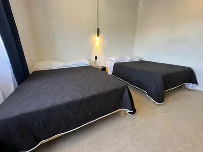Cama o camas de una habitación en Hotel Caminos