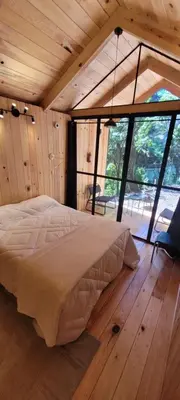 Cama o camas de una habitación en Cabañas Vive el Bosque