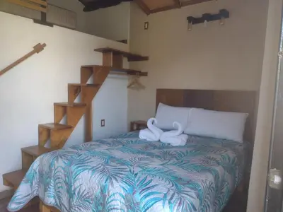 Cama o camas de una habitación en Aldea Xochi cabañas