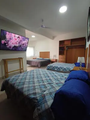 Cama o camas de una habitación en Bungalow Lomas de Cocoyoc