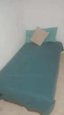 Cama o camas de una habitación en Departamentos RomTen