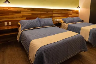 Cama o camas de una habitación en Hotel Casa Tsumbak
