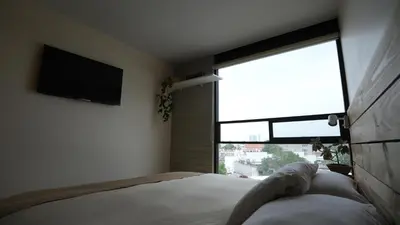 Cama o camas de una habitación en Skyline y terraza privada Penthouse en CDMX