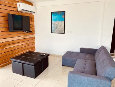 Una televisión o centro de entretenimiento en Vista al mar, Mini alberca y roof garden PRIVADO!
