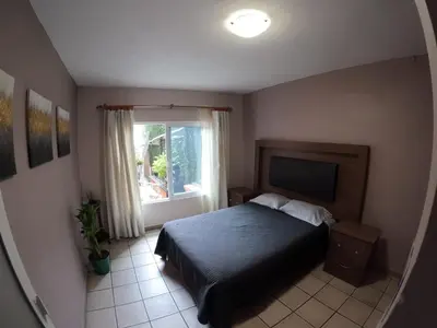 Cama o camas de una habitación en Casa León
