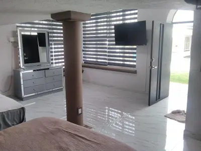 Una televisión o centro de entretenimiento en Casa Bugambilias