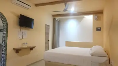 Cama o camas de una habitación en Hotel tortuga real Huatulco