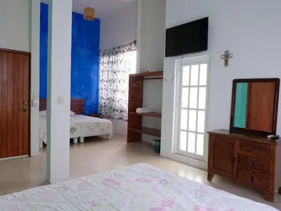 Cama o camas de una habitación en Casa de la abuela costeña