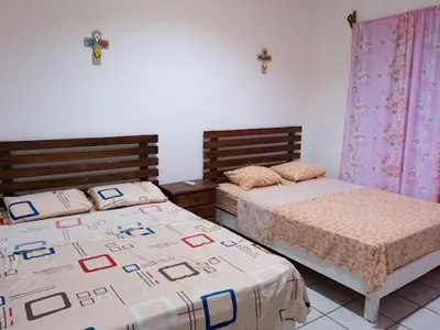Cama o camas de una habitación en Casa de la abuela costeña