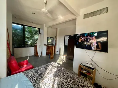 Una televisión o centro de entretenimiento en La Punta SurfHouse AC Starlink