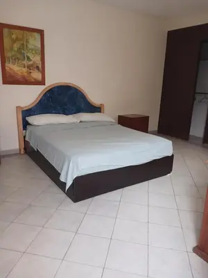 Cama o camas de una habitación en Casa con alberca y jardin en parres jiutepex