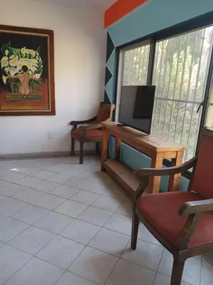 Una televisión o centro de entretenimiento en Casa con alberca y jardin en parres jiutepex