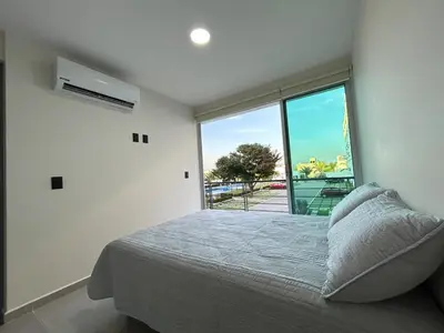 Cama o camas de una habitación en Depa Nuevo Acapulco Diamante